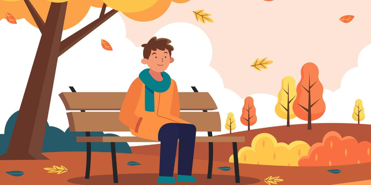 Guy Sitting On Park Bench